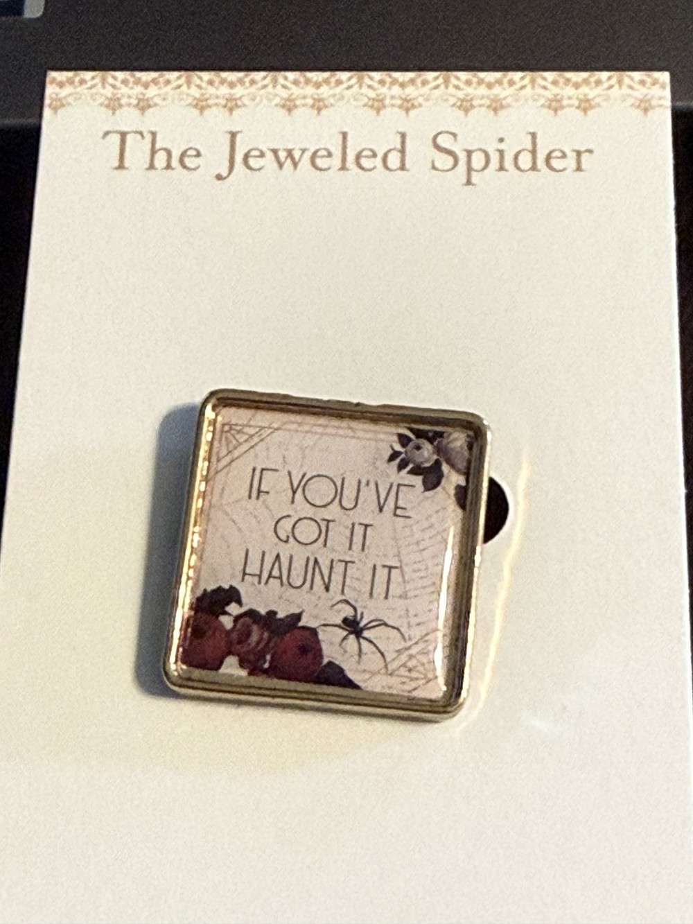 Brooch Pin - Gold Medallion with If You've got it haunt it with a spider and roses