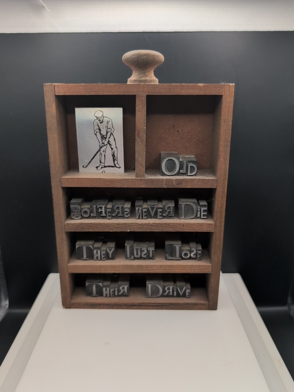 Backwords handmade golf-theme typecut shelf
