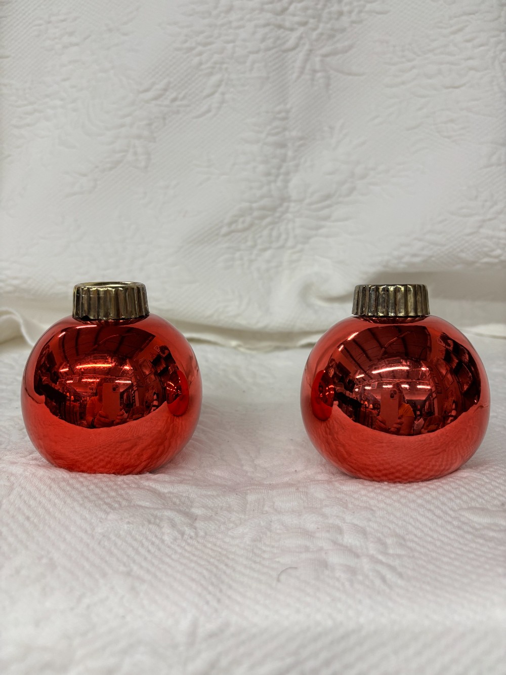 Pair of red shiny ornament candle holders