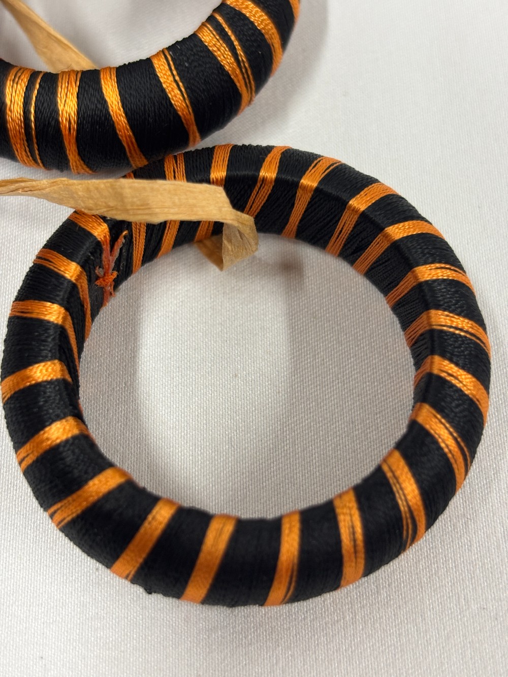 Halloween linens napkin rings 10 black w/orange stripes thread over wood