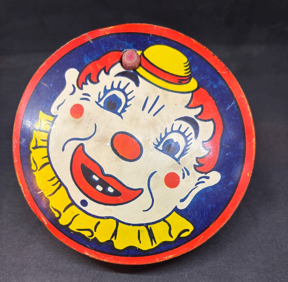 1960's Clown face tin litho noise maker