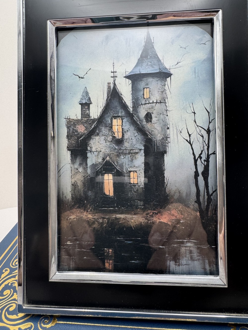 HAUNTED HOUSE PRINT, FRAMED IN BLACK & SILVER