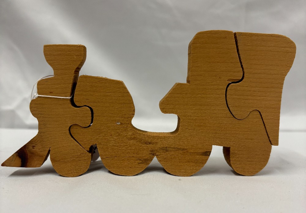 Toy handmade unfinished wooden puzzle train engine w/cow catcher