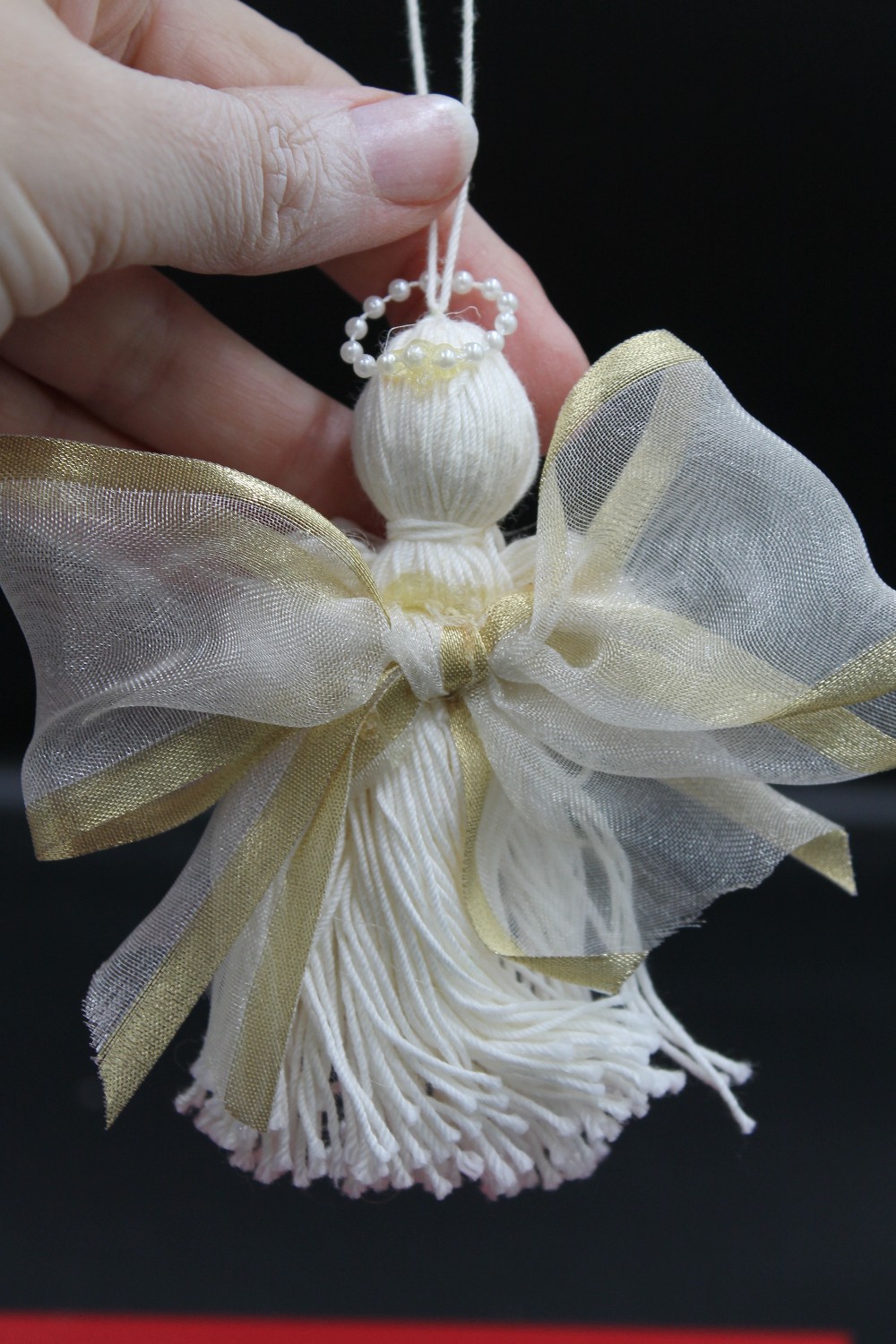Handmade yarn tassel angel ornament