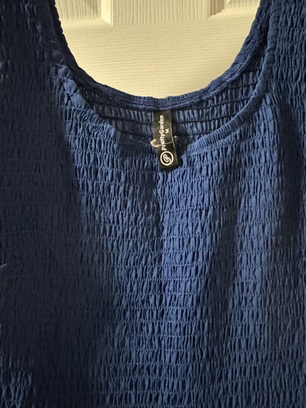 NAVY SMOCKED TIERED DRESS,