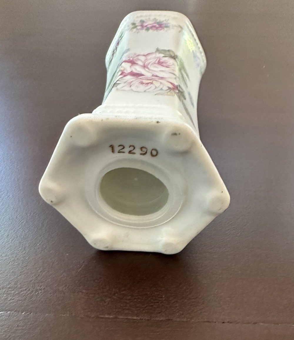 Antique porcelain hat pin holder. Pink rose motif.