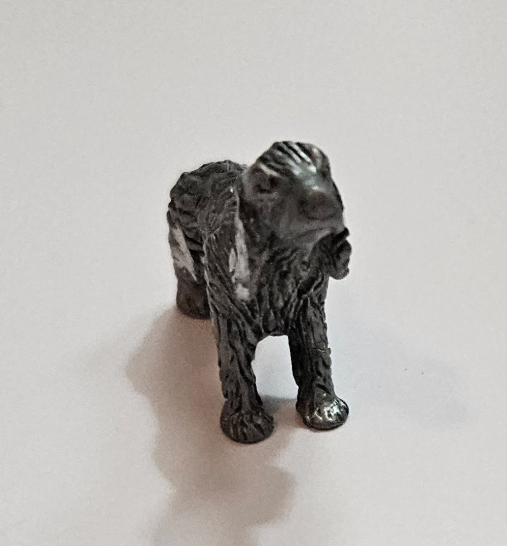 silver-tone metal spaniel figurine featuring