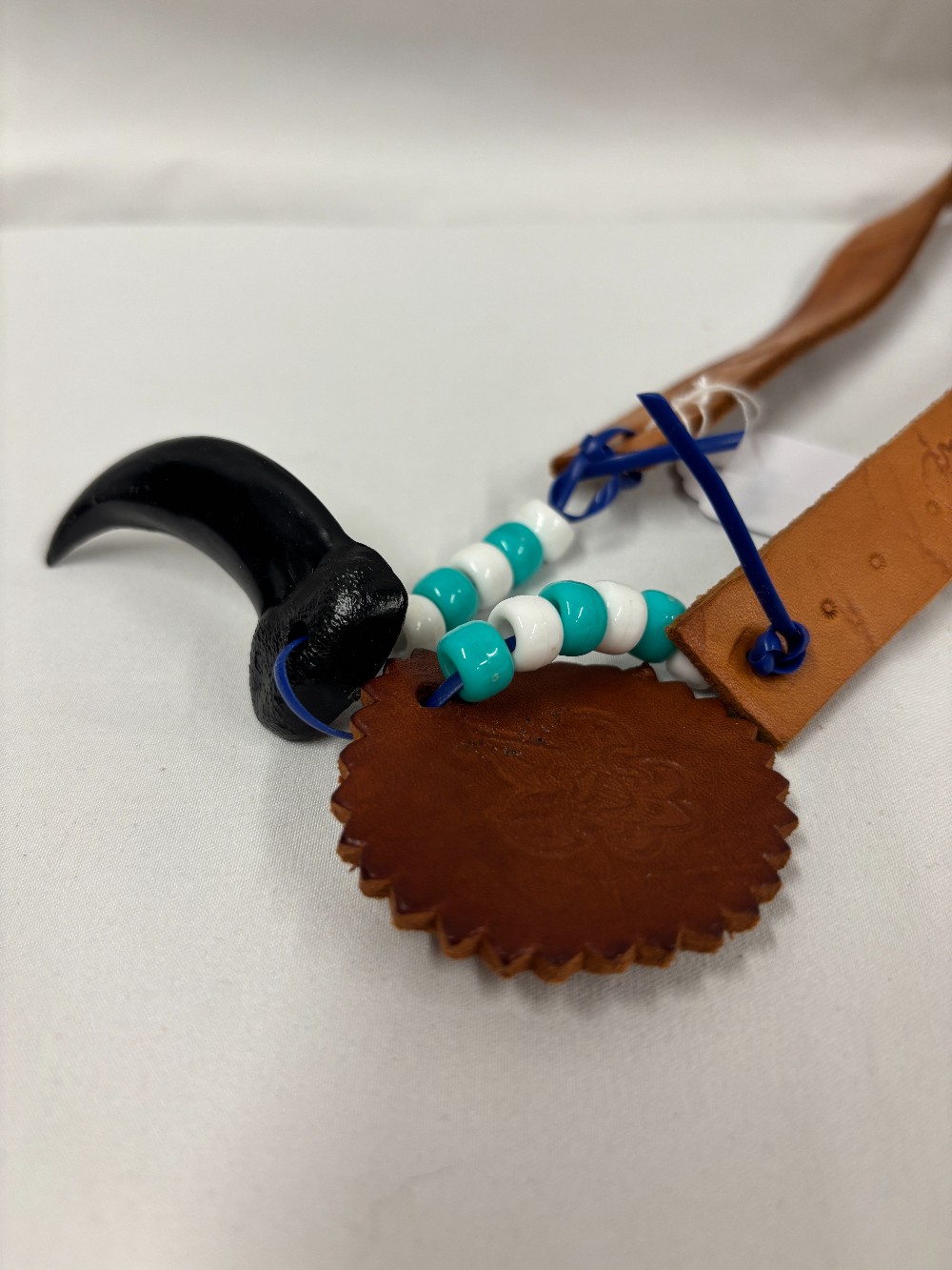 Leather stamped headband white/turquois beads & plastic bear claw 1990's.