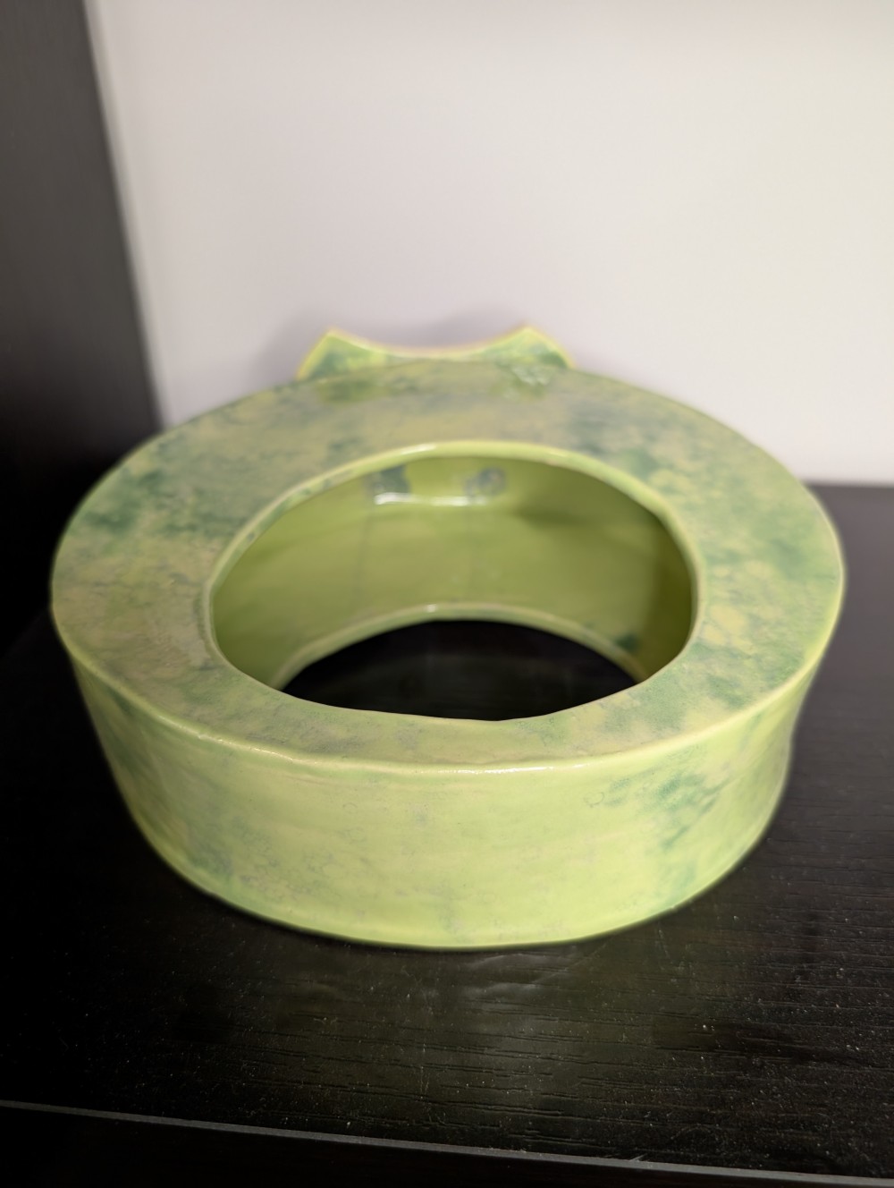 Abstract green handmade pottery piece