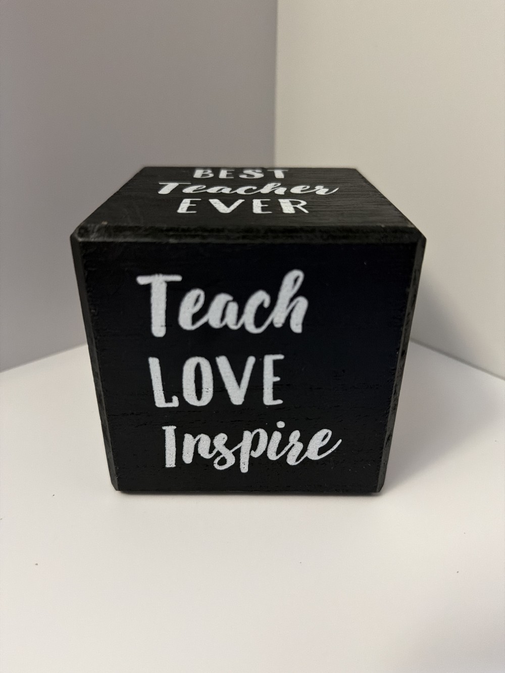Teacher black wooden cube