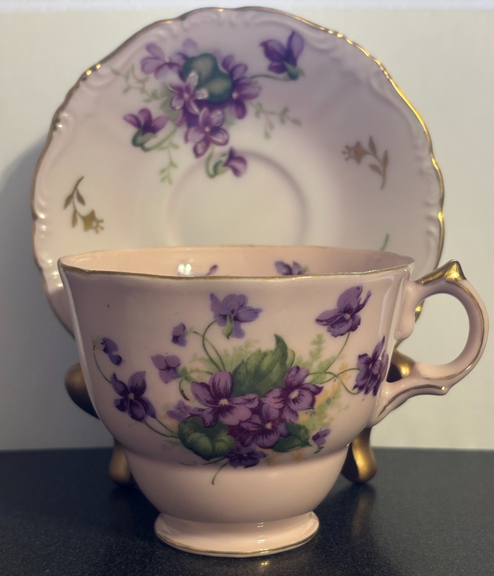 Mismatched porcelain pink w/violets & gold trim cup & saucer