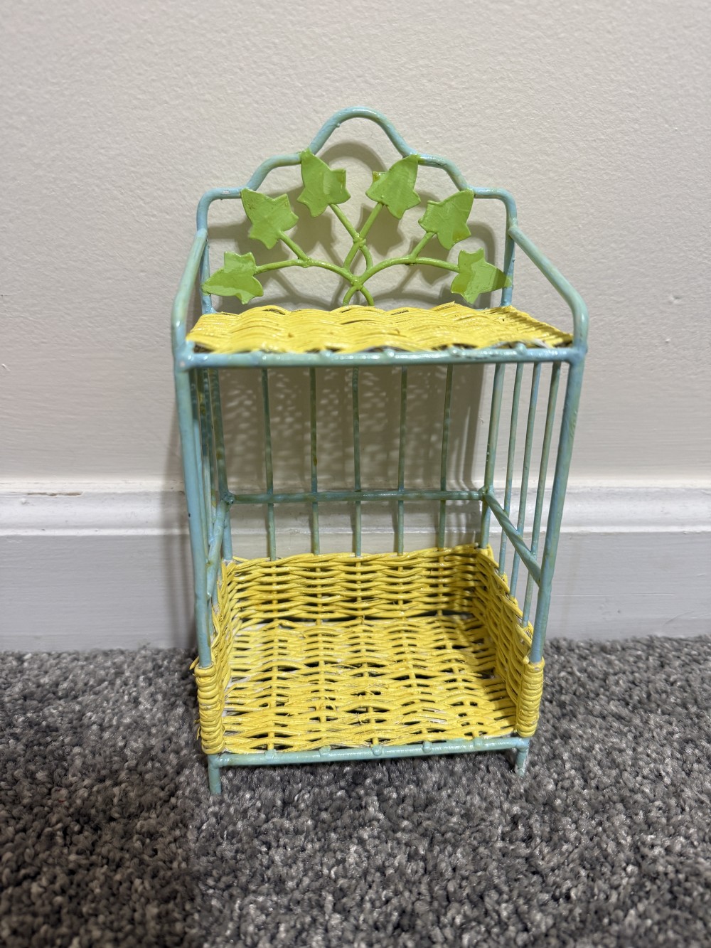 Tiny wicker and metal shelf