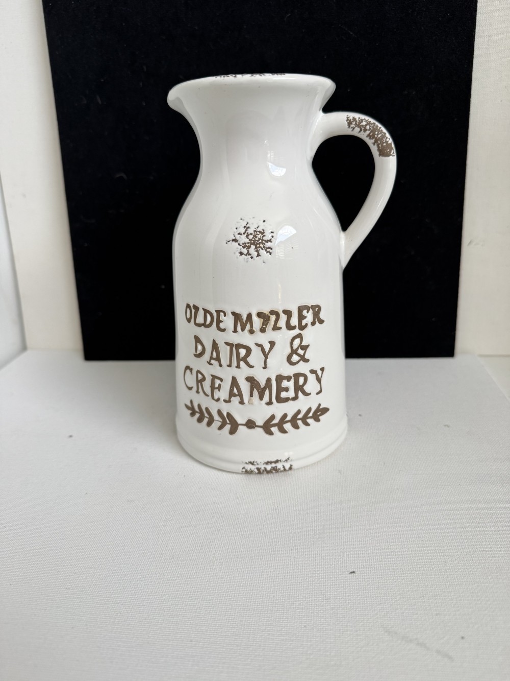 PITCHER, POTTERY CREAMER WITH DESIGNS