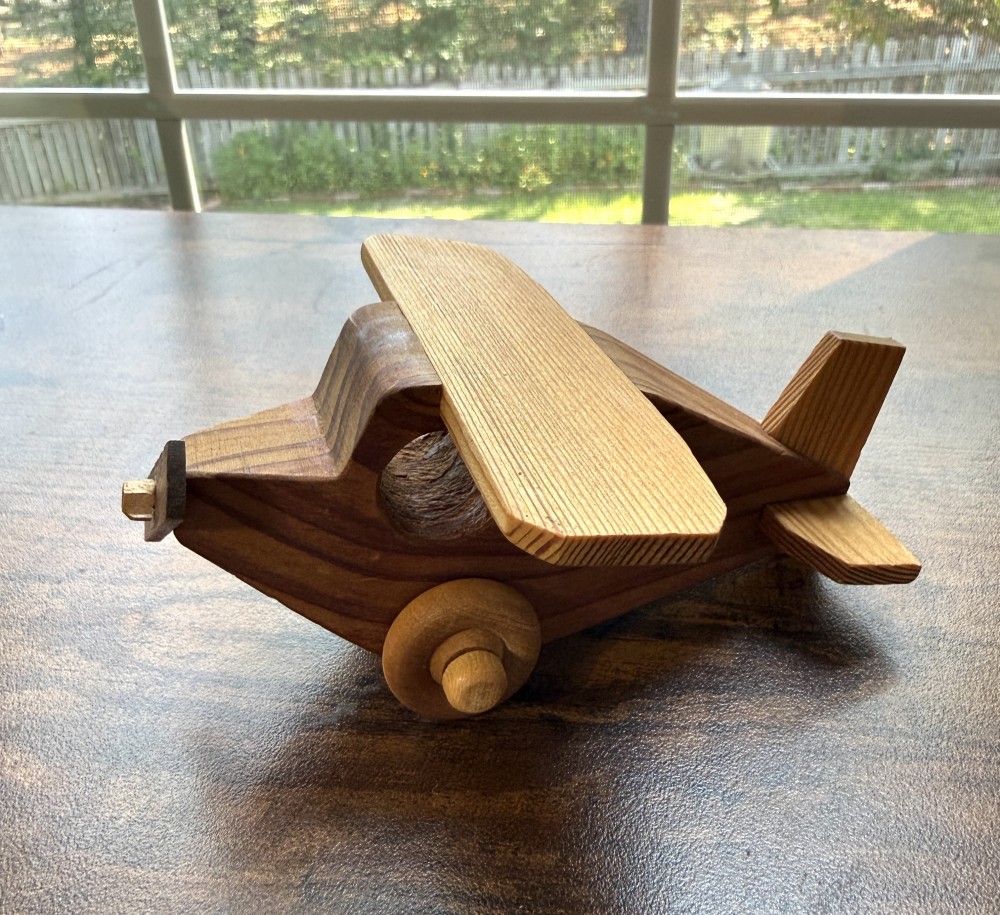 Handmade wooden biplane toy