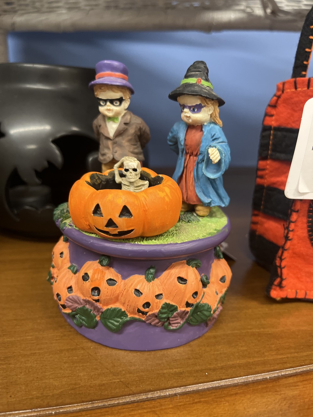Two Halloween kids and a skeleton