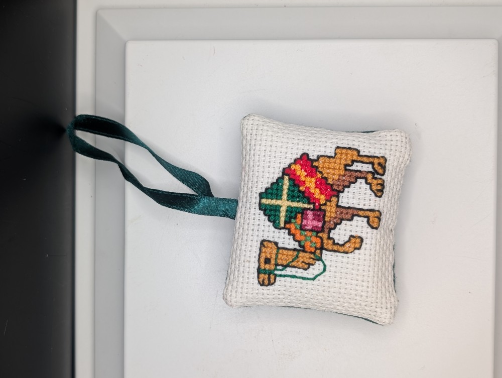 Cross-stitch camel Christmas ornament, made in Iraq