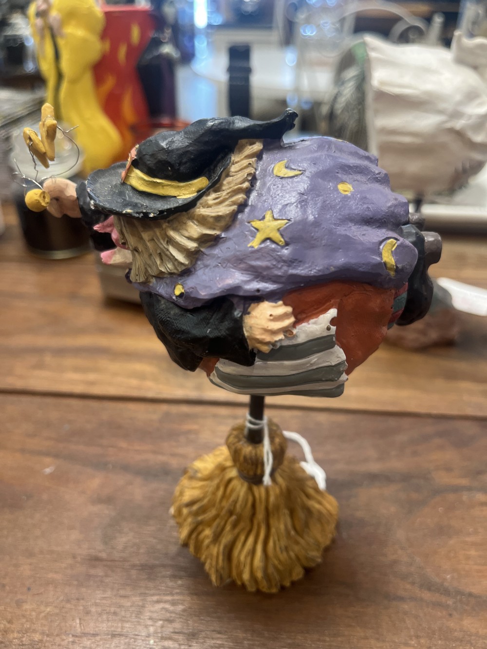 Halloween flying witch on a broomstick stand
