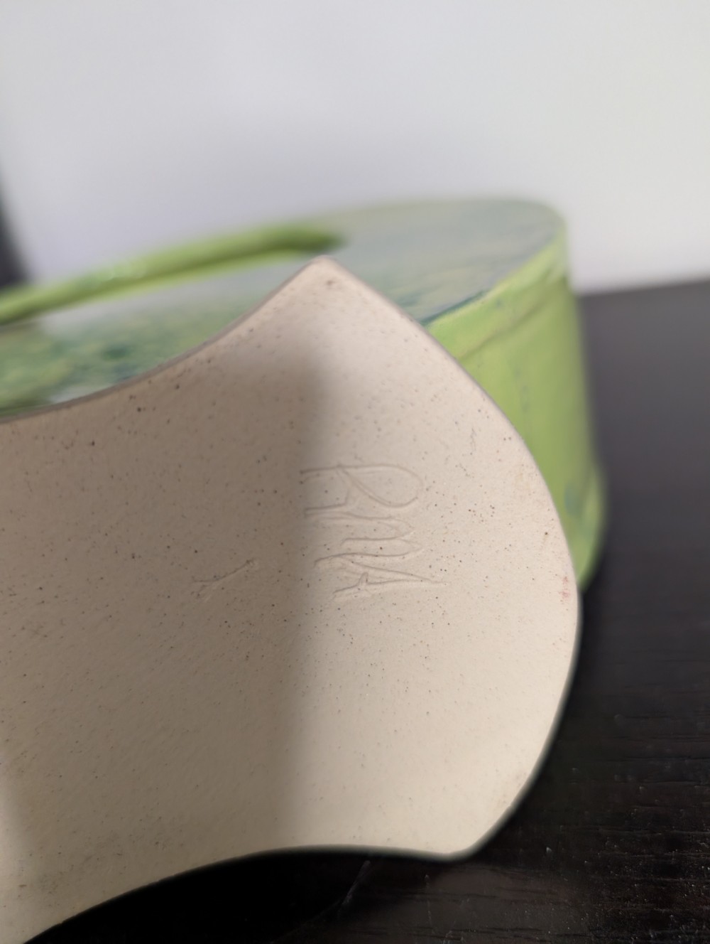 Abstract green handmade pottery piece