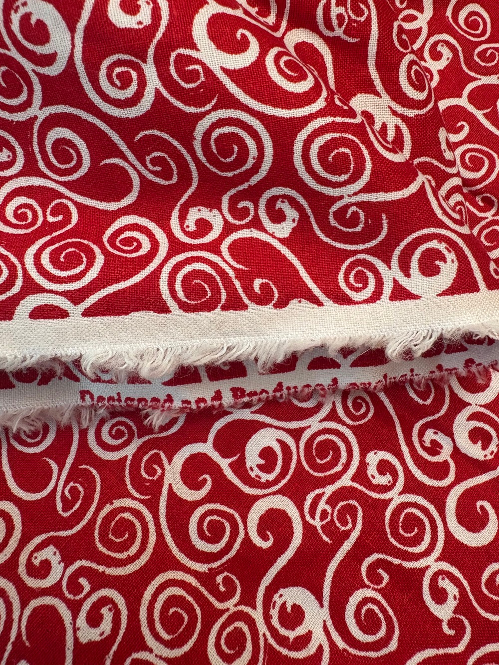 Hooked Swirls on Red by Jo-Anns Fabric - Cotton: