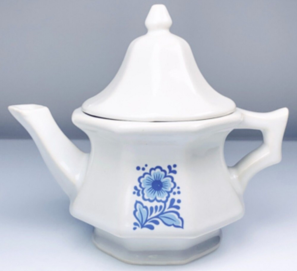 vintage Avon ceramic teapot with a blue flower motif