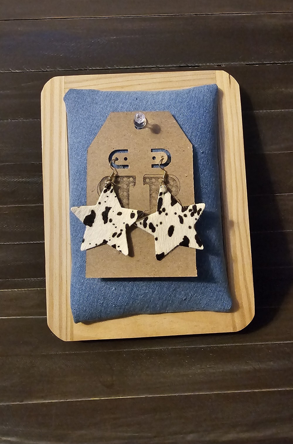 Star cow print earrings