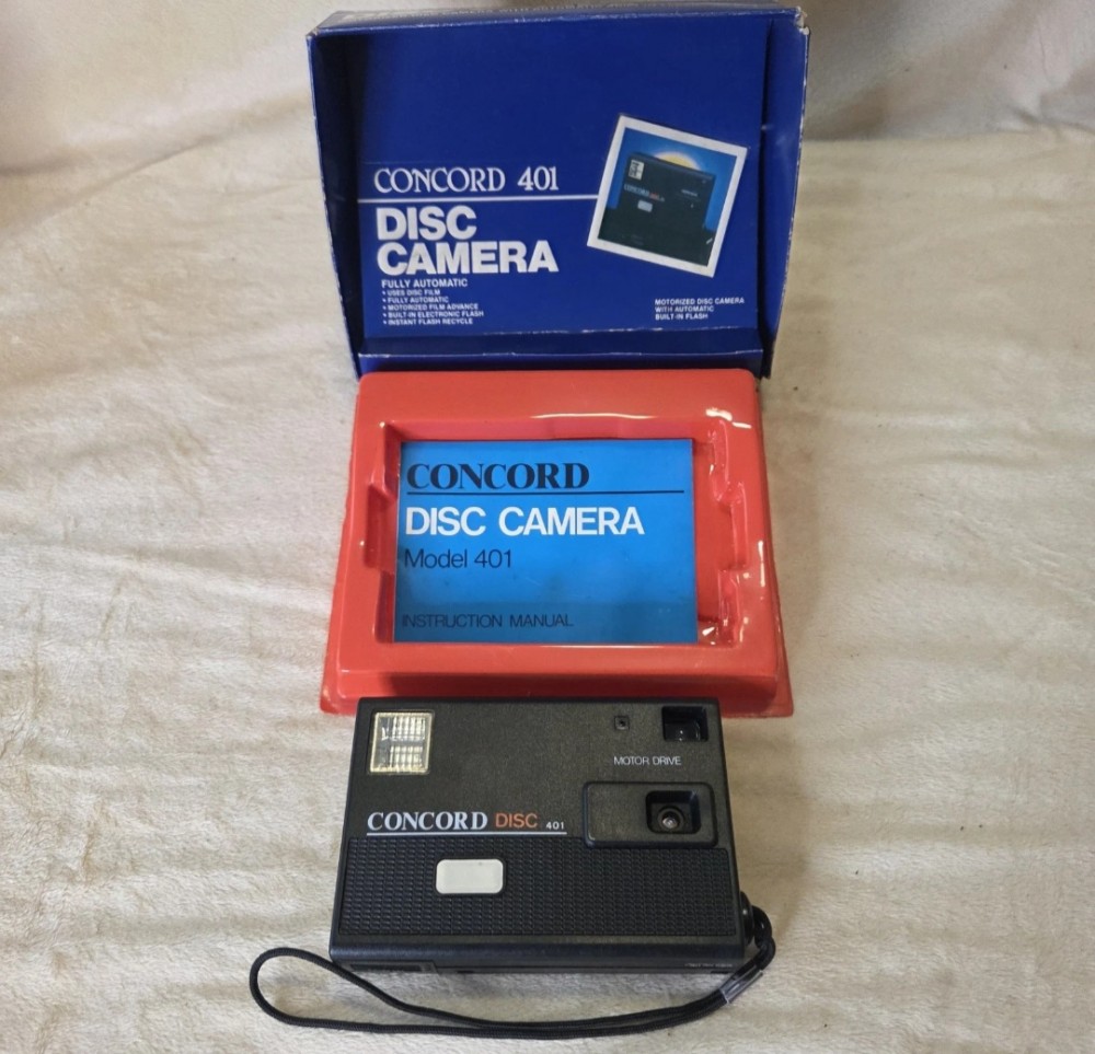VTG 1980s Concord 401 Disc Camera Untested With Box & Manual. Untested.
