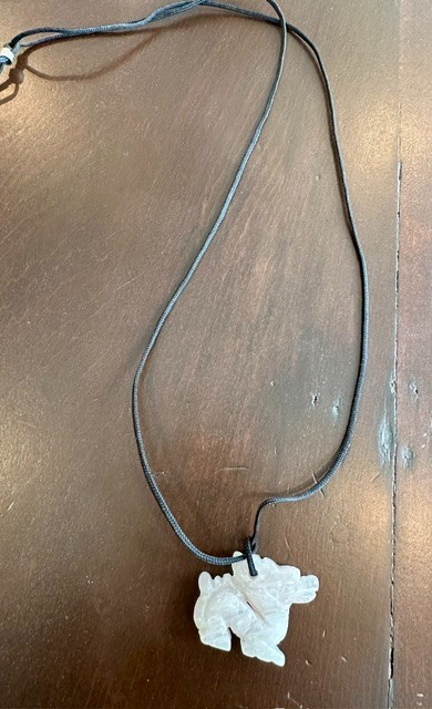 Carved rose quartz pixiu pendant with black cord