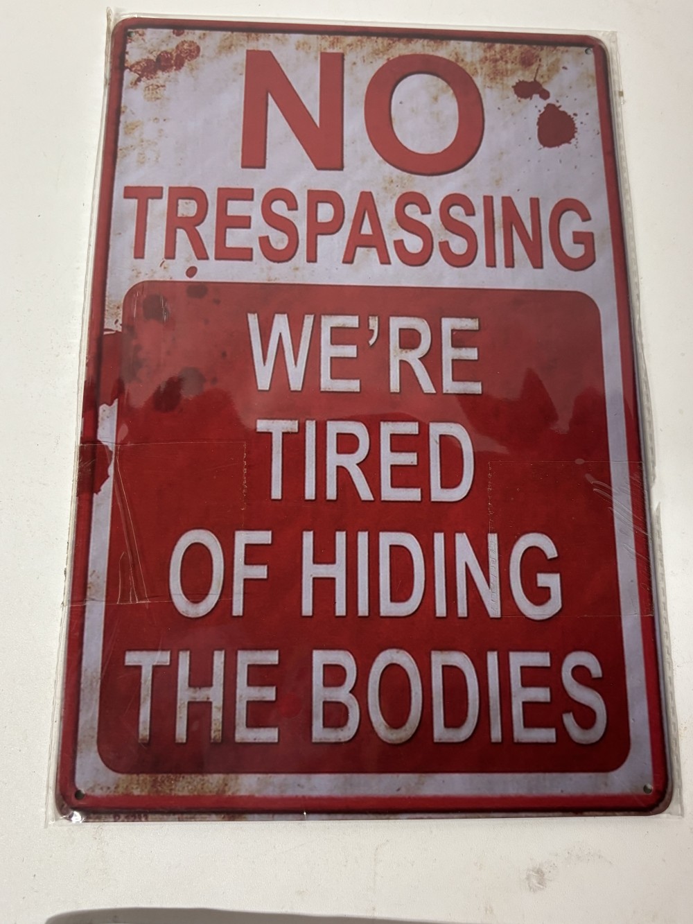 No Trespassing We're Tired of Hiding The Bodies novelty metal sign