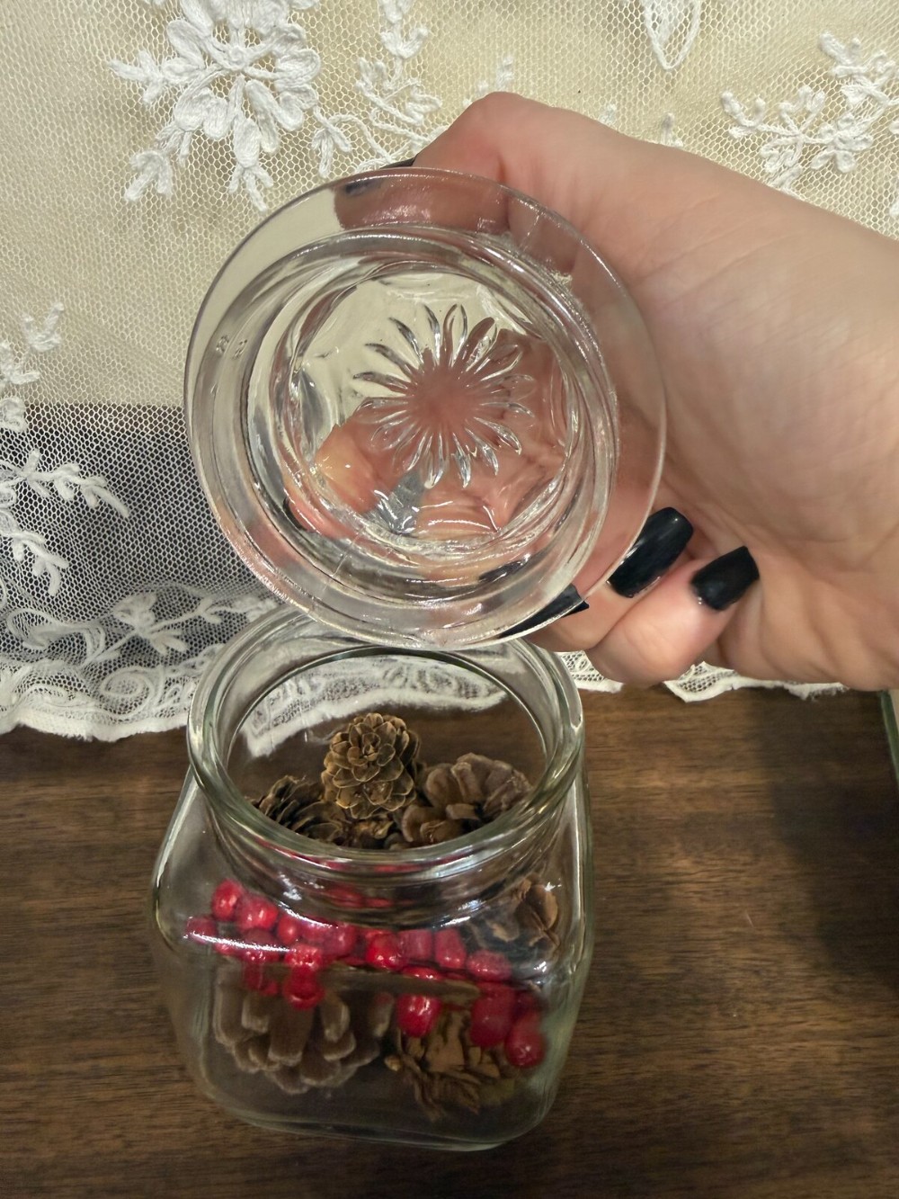 Square Glass Jar with Lid Filled with Pinecones and Red Berries