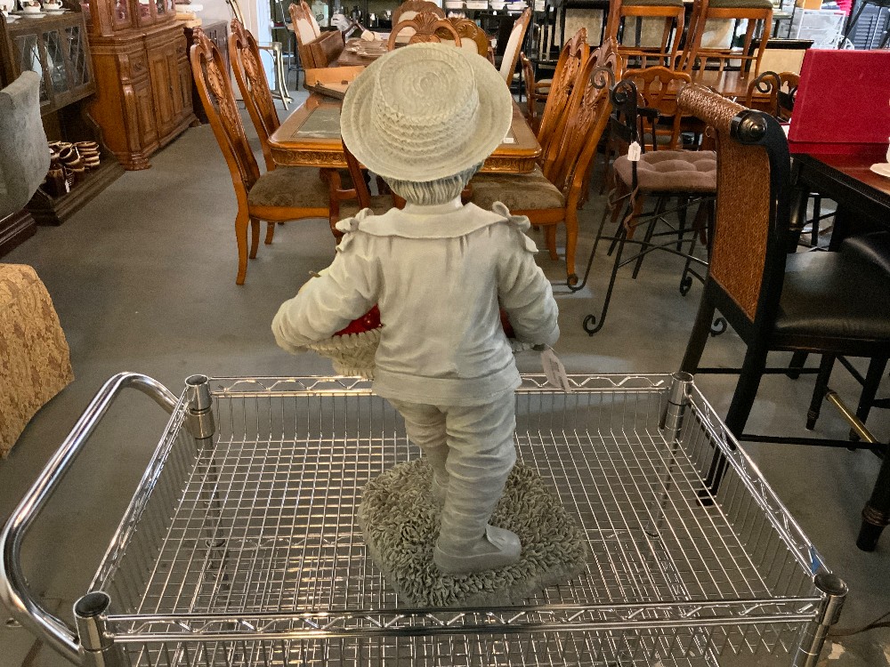 Statue of Boy Holding Fruit