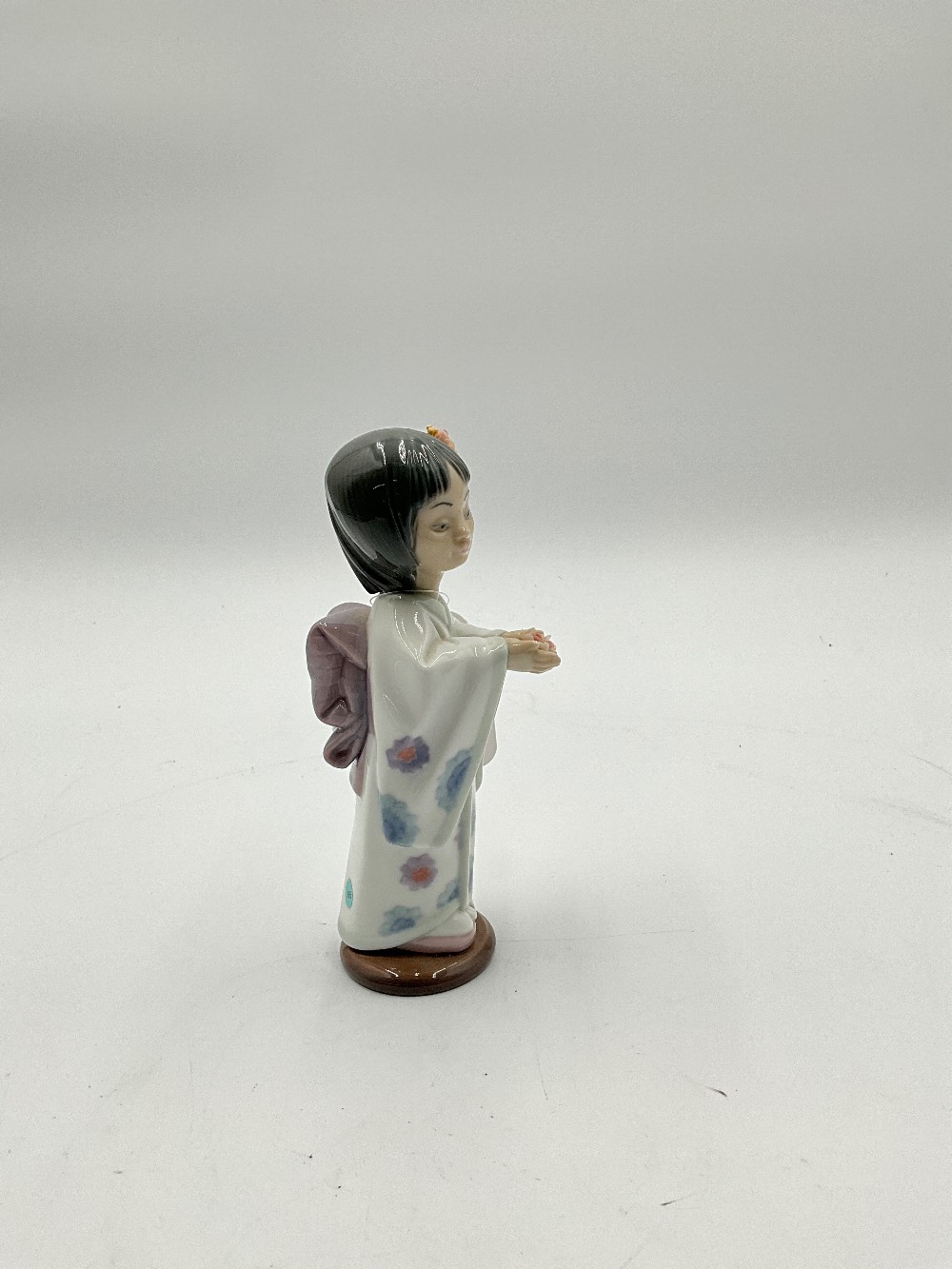 Lladro Bearing Flowers Figurine