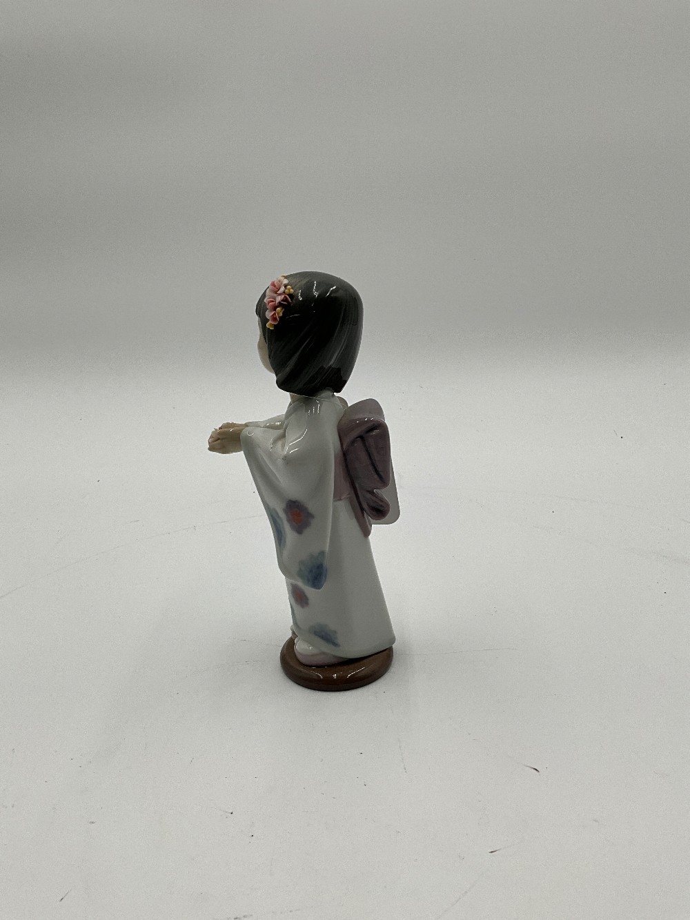 Lladro Bearing Flowers Figurine