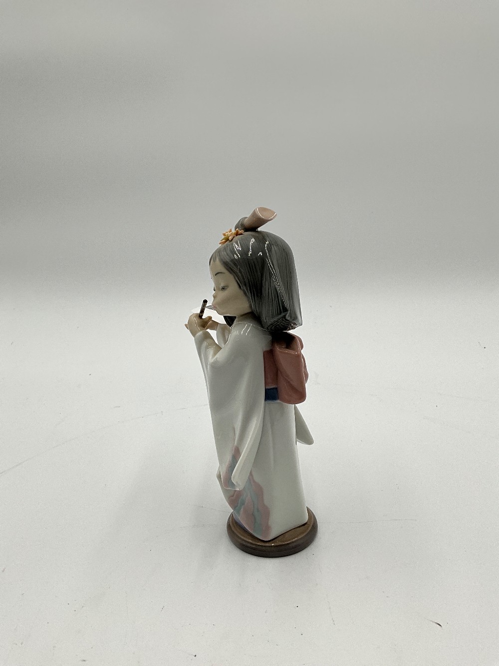 Playing The Flute Figurine