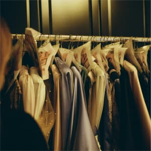 upclose photo of clothing on a rack.