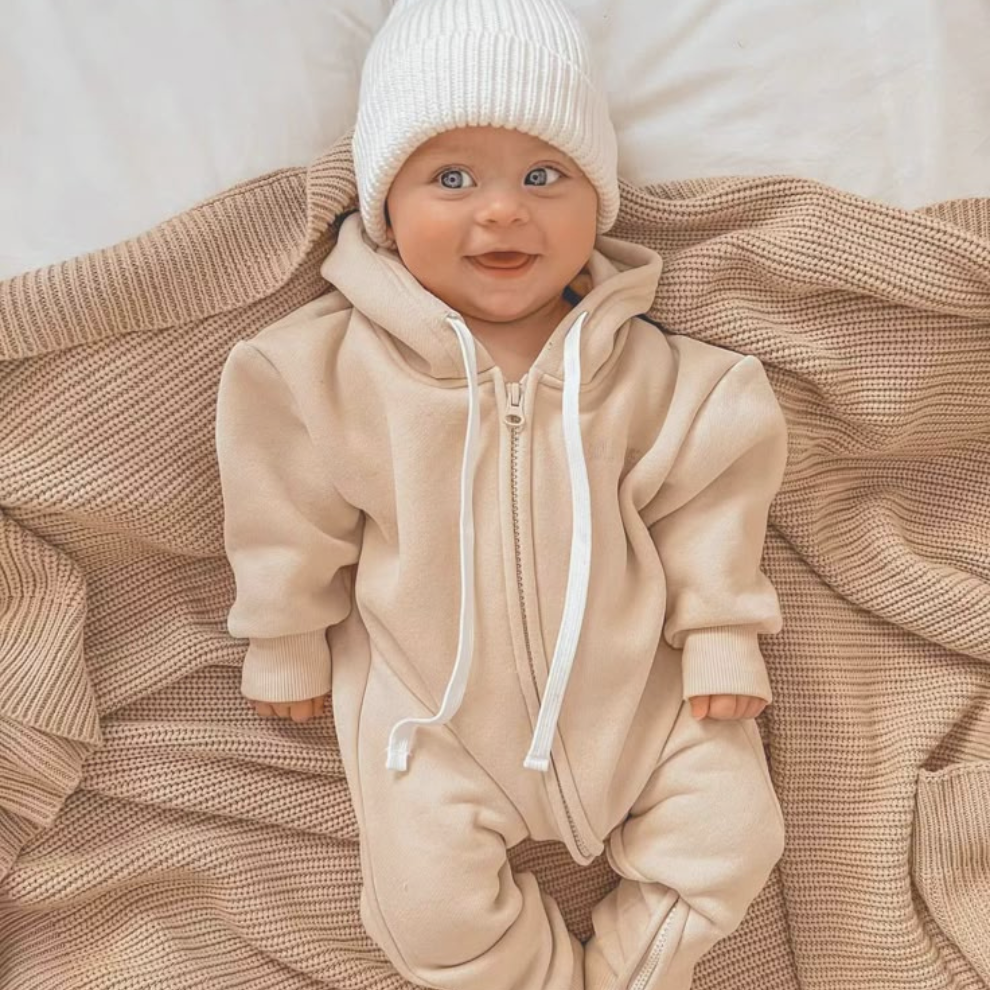 picture of a baby laying on a bed
