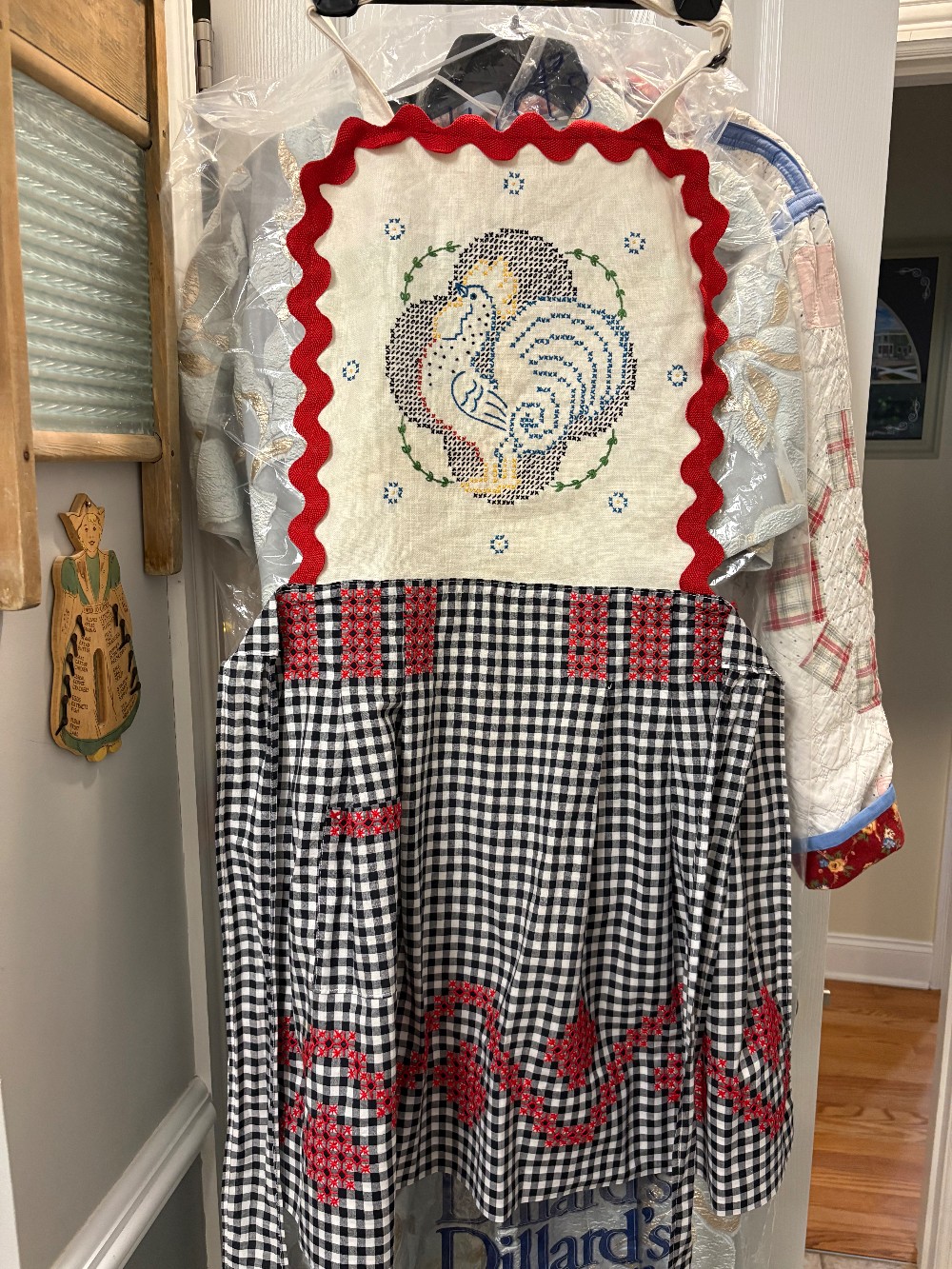 Black and white gingham apron with a bib added that has an embroidered chicken