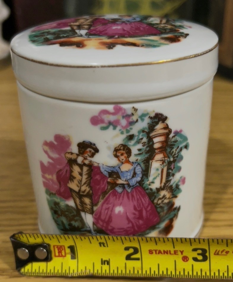 Vintage porcelain jar or cup featuring courting couple scene