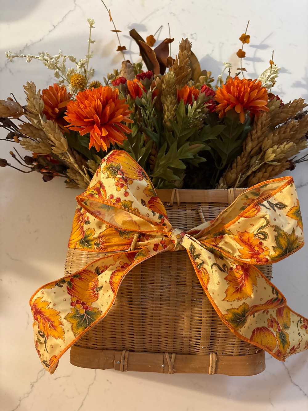 Fall floral arrangement with vintage basket