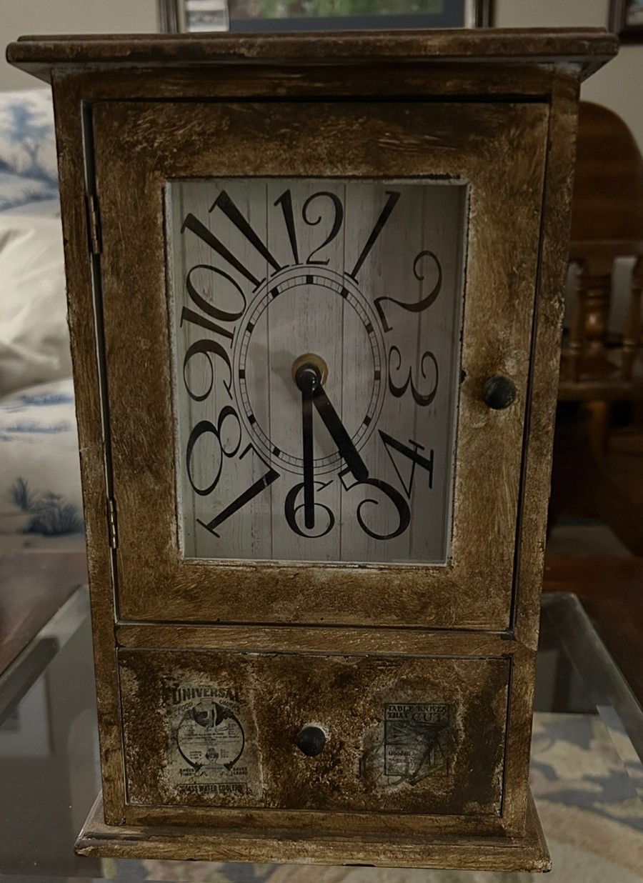 Rustic brown clock with a drawer at the bottom