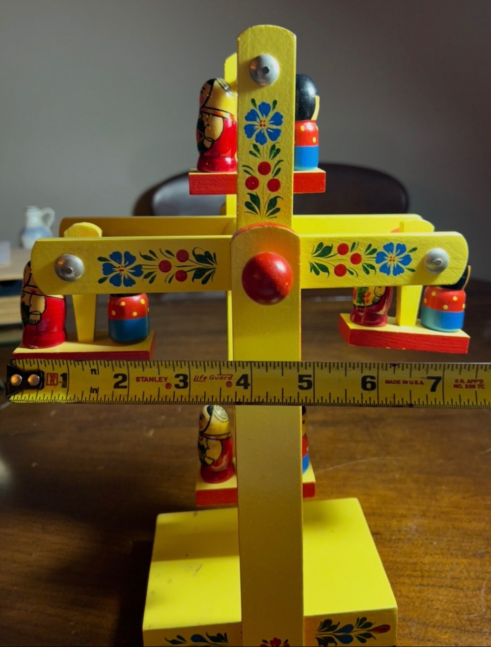 A vintage hand-painted  wooden Matryoshka doll Ferris wheel