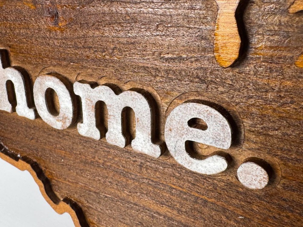2605 - Layered wooden design shaped like the United States of America with the word 