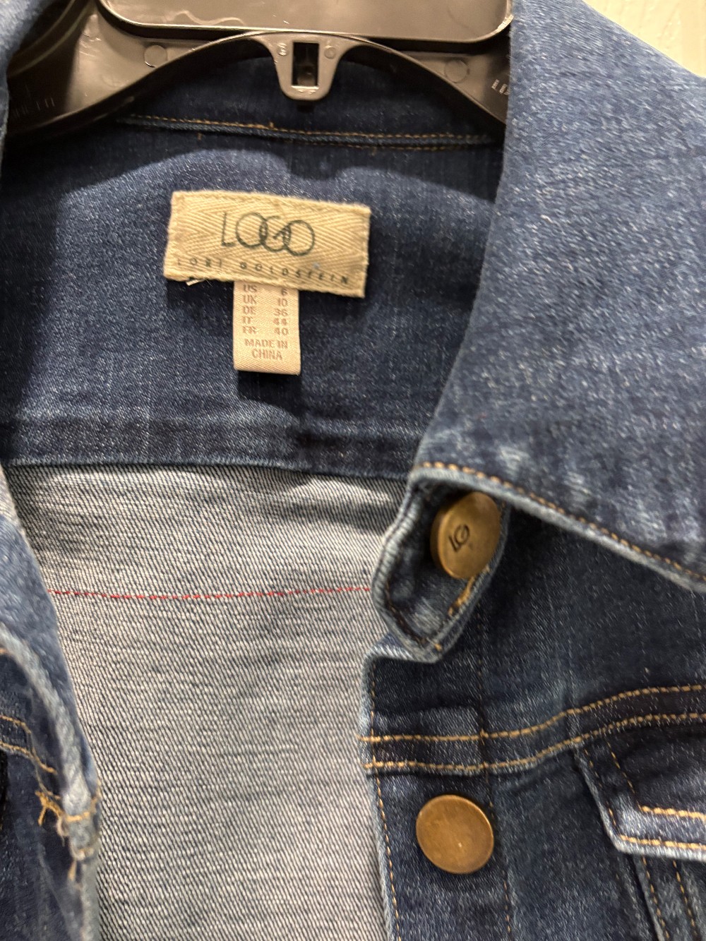 Jean jacket with scrappy fabric flag on back!