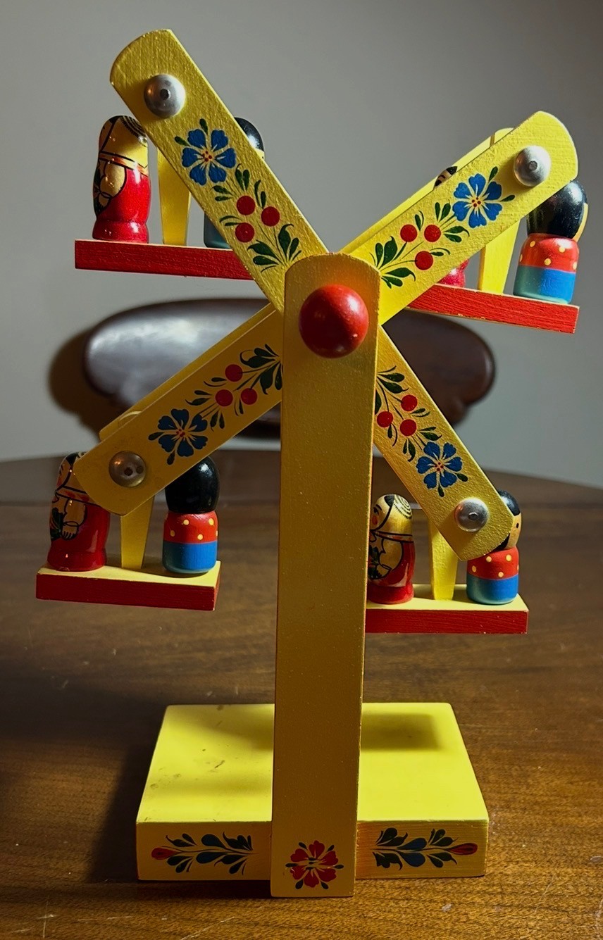 A vintage hand-painted  wooden Matryoshka doll Ferris wheel