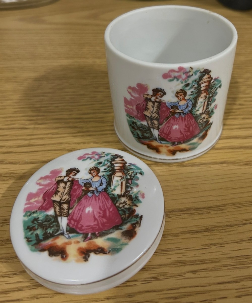 Vintage porcelain jar or cup featuring courting couple scene