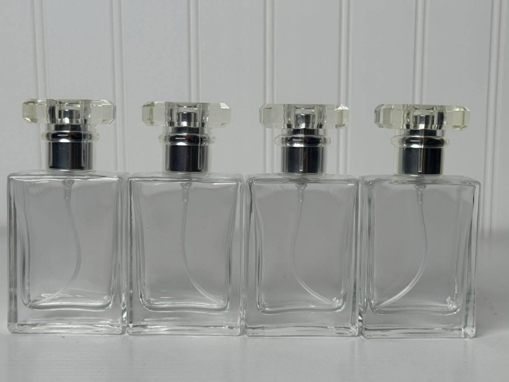 2546 - Clear, rectangular empty glass spray bottle designed for perfume or cosmetics (2x1x4)