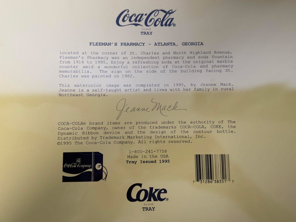2676 - 1995 Coca-Cola serving tray of a watercolor painting of Fleeman's Pharmacy in Atlanta, Georgia, signed by artist Jeanne Mack..  Depicts the historic pharmacy and soda fountain that operated from 1914 to 1995