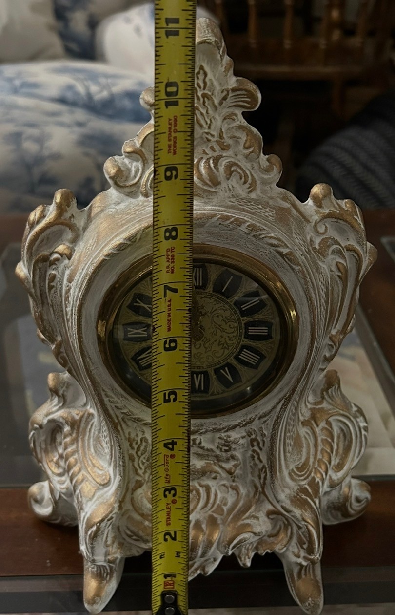 Ornate white and gold vintage clock