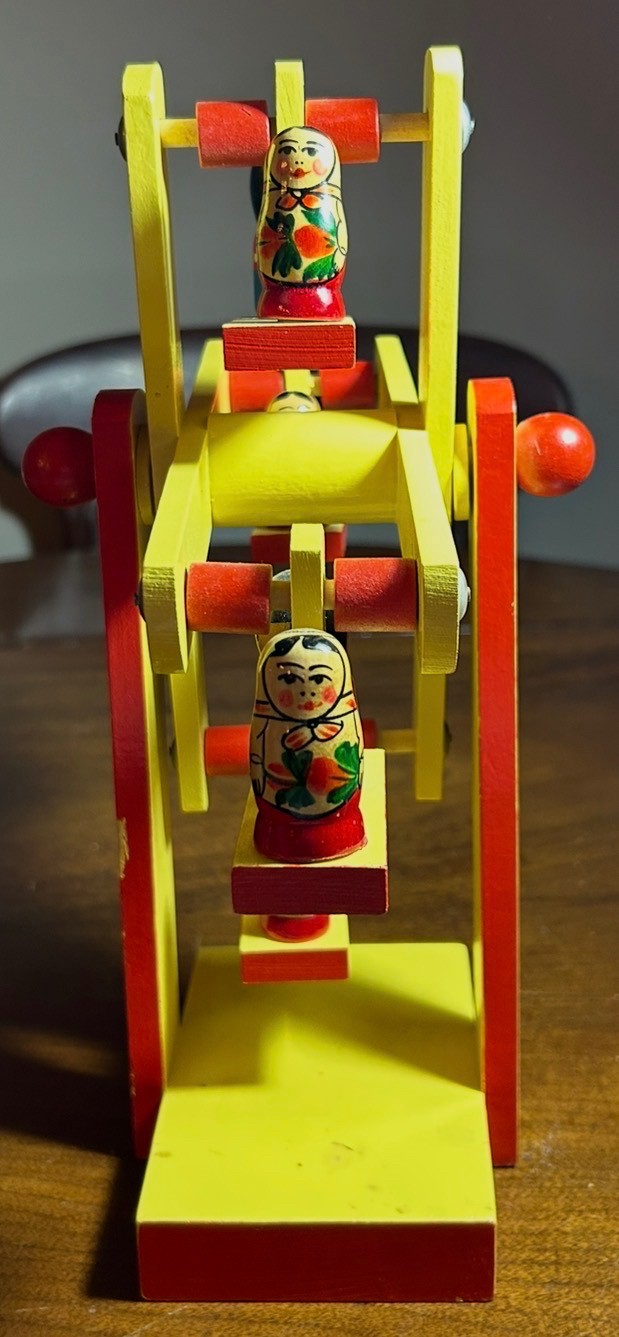 A vintage hand-painted  wooden Matryoshka doll Ferris wheel