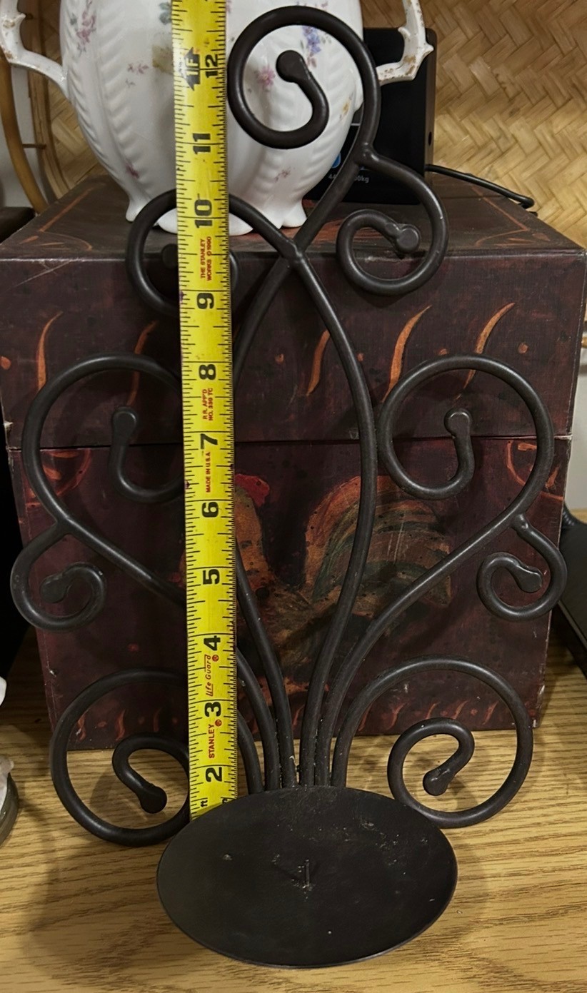 Black metal scroll candle holder