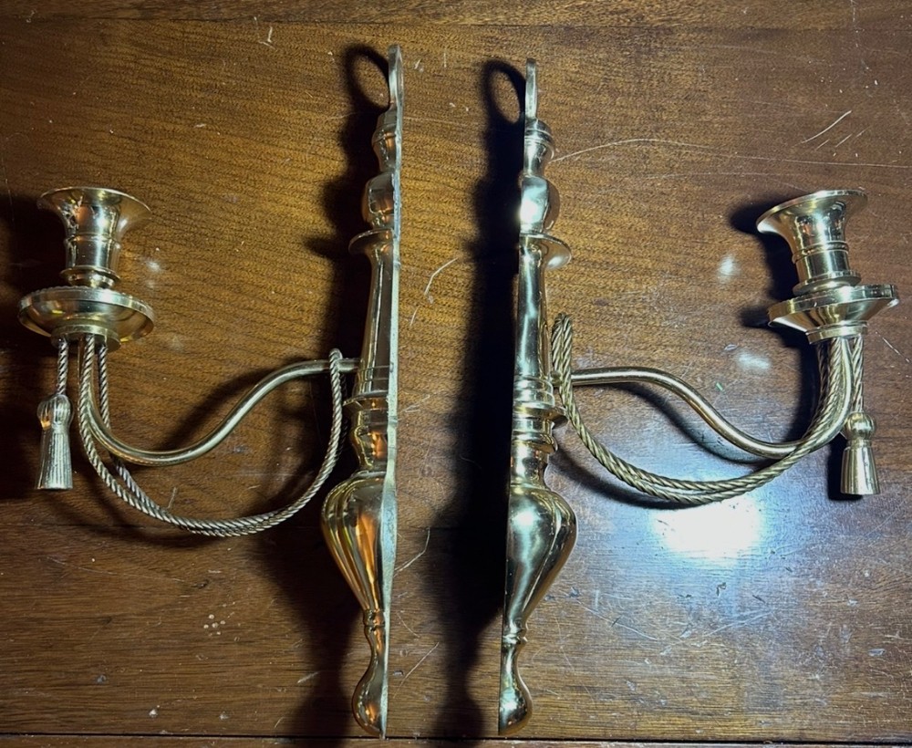 Vintage pair of brass wall sconces with rope and tassel detail